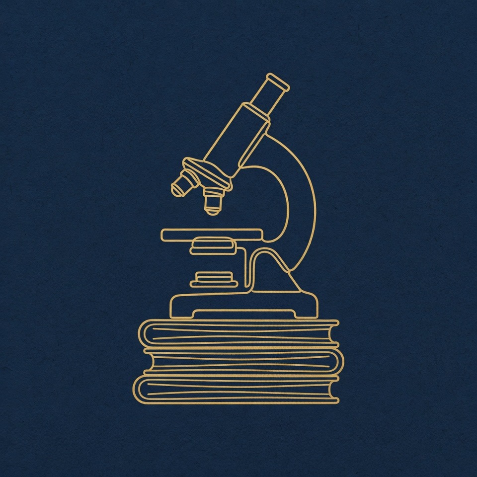 Microscope resting on a stack of bound journals, gold on navy